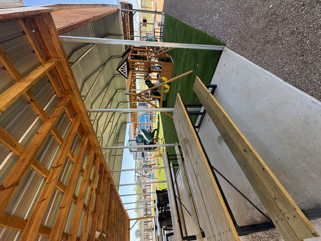 Covered pavilion with picnic tables and playground views at The Playground @niederwald